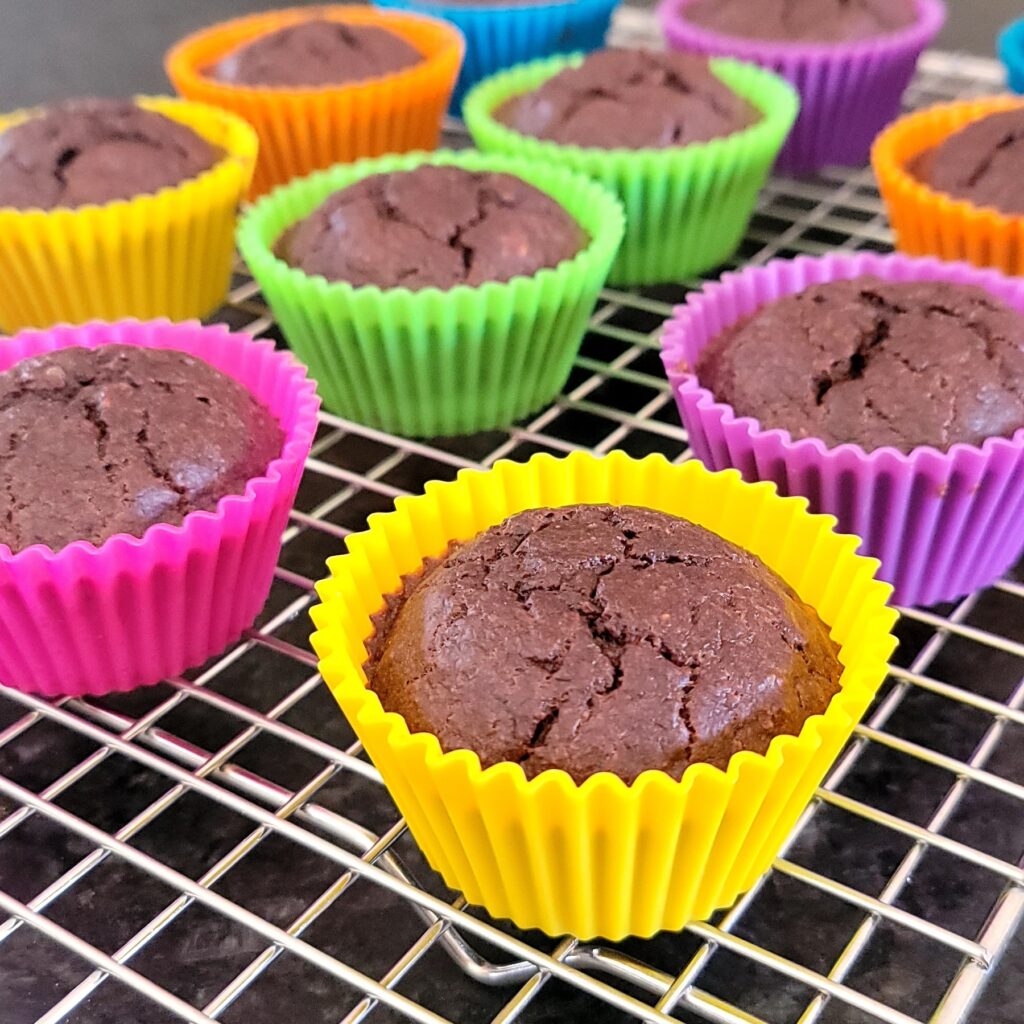 Healthy chocolate banana oat muffins on a cooling rack