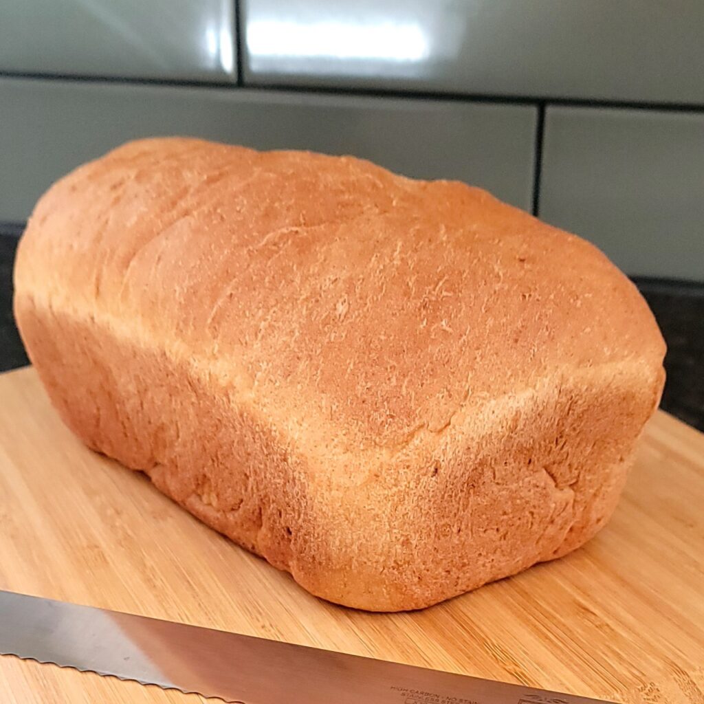 Fully cooked loaf of honey oat wheat bread